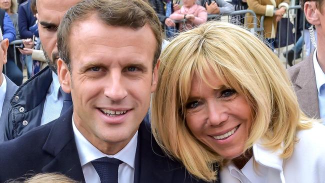 Emmanuel Macron and his wife Brigitte (R) greet well-wishers a they leave a polling station in Le Touquet.Picture: AFP.