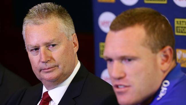 Swann with then Brisbane Lions coach Justin Leppitsch in 2014. Picture: Darren England