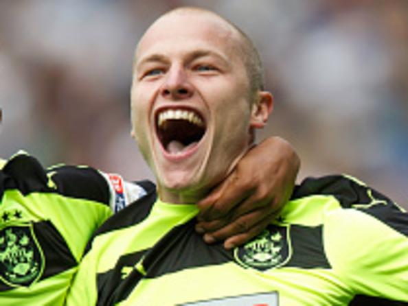 LEEDS, ENGLAND - SEPTEMBER 10: Aaron Mooy of Huddersfield Town celebrates with Elias Kachunga of Huddersfield Town after scoring to make it 0-1 during the Sky Bet Championship match between Leeds United and Huddersfield Town at Elland Road on September 10, 2016 in Leeds, England. (Photo by Robbie Jay Barratt - AMA/Getty Images)