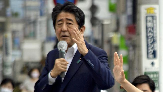 Japanese former Shinzo Abe speaks for his party member candidate of the House of Councillors Election near Yamato Saidaiji Station in Nara Prefecture on July 8, 2022, just seconds before he is shot.  Â  67-year-old Abe has reportedly been shot in the chest and he has been in a state of cardio-respiratory arrest. ( The Yomiuri Shimbun ) (Photo by Kazuhiko Hirano / Yomiuri / The Yomiuri Shimbun via AFP)