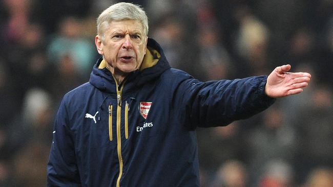 Arsenal's manager Arsene Wenger gestures during the English Premier League soccer match between Stoke City and Arsenal at the Britannia Stadium, Stoke on Trent, England, Sunday, Jan. 17, 2016. (AP Photo/Rui Vieira)