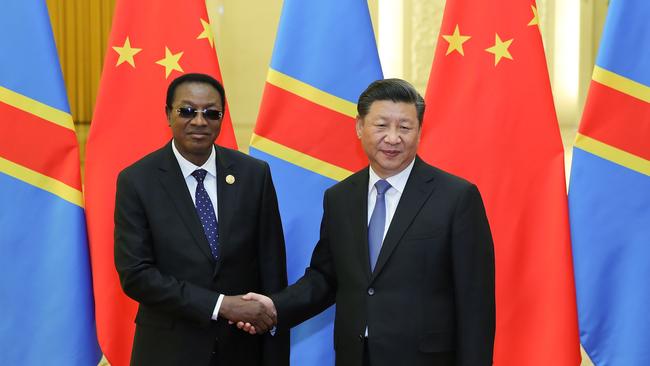 CORRECTION - Chinese President Xi Jinping (R) shakes hands with Prime Minister of the Democratic Republic of the Congo Bruno Tshibala Nzenze during a meeting at the Great Hall of the People in Beijing on September 6, 2018. (Photo by Lintao Zhang / POOL / AFP) / “The erroneous mention[s] appearing in the metadata of this photo by Lintao Zhang has been modified in AFP systems in the following manner: [-Prime Minister of the Democratic Republic of the Congo Bruno Tshibala Nzenze--] instead of [-Congo President Denis Sassou Nguesso--]. Please immediately remove the erroneous mention[s] from all your online services and delete it (them) from your servers. If you have been authorized by AFP to distribute it (them) to third parties, please ensure that the same actions are carried out by them. Failure to promptly comply with these instructions will entail liability on your part for any continued or post notification usage. Therefore we thank you very much for all your attention and prompt action. We are sorry for the inconvenience this notification may cause and remain at your disposal for any further information you may require.”