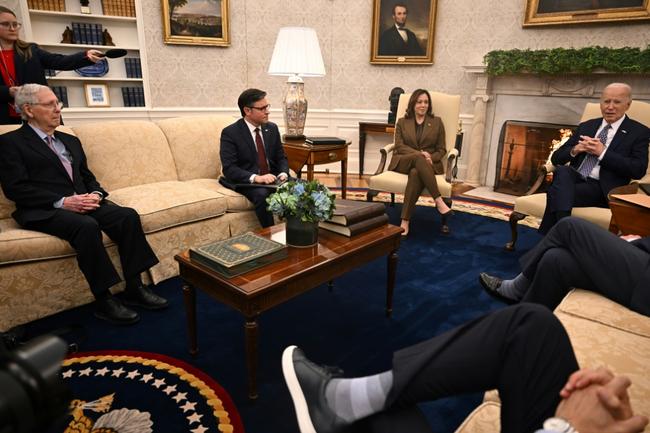 US President Joe Biden (R) and Vice President Kamala Harris (3rd L) meet with House Speaker Mike Johnson (2nd L) and Senate Minority Leader Mitch McConnell (L) in the Oval Office of the White House in Washington, DC on February 27, 2024. Biden is meeting with the congressional leaders in a bid to unlock billions of dollars in stalled emergency aid to Ukraine and avert a looming government shutdown at home.