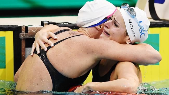 Kaylee McKeown, right, hugs Emily Seebohm in Adelaide on Sunday night. Picture: Getty Images)