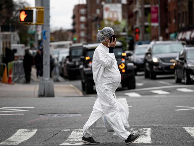 A pregnant woman protects herself against the coronavirus while out in New York City, which remains the epicentre of the virus in the US. Picture: AFP