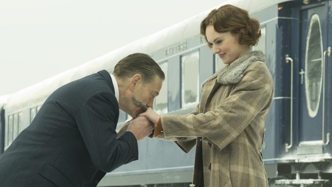 Kenneth Branagh as Hercule Poirot and Daisy Ridley as Mary Debenham in a scene from Twentieth Century Fox's film Murder on the Orient Express.