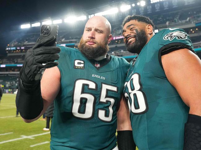 PHILADELPHIA, PENNSYLVANIA - JANUARY 12: Lane Johnson #65 and Jordan Mailata #68 of the Philadelphia Eagles take a selfie after the game against the Green Bay Packers during the NFC Wild Card Playoff at Lincoln Financial Field on January 12, 2025 in Philadelphia, Pennsylvania.   Mitchell Leff/Getty Images/AFP (Photo by Mitchell Leff / GETTY IMAGES NORTH AMERICA / Getty Images via AFP)