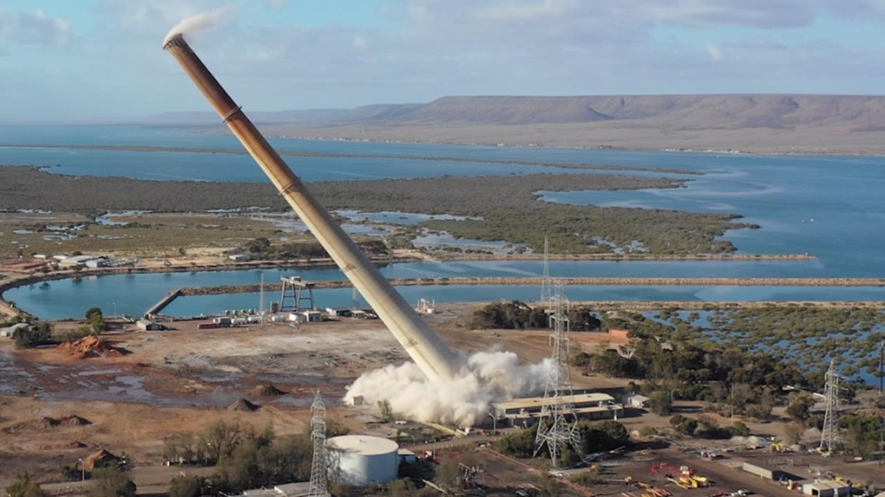 A 200m chimney stack at Port Augusta’s defunct coal-fired power station is felled in a controlled explosion in 2018. Picture: Supplied