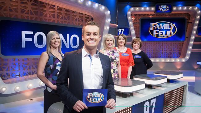 Family Feud host Grant Denyer on the set of the show.