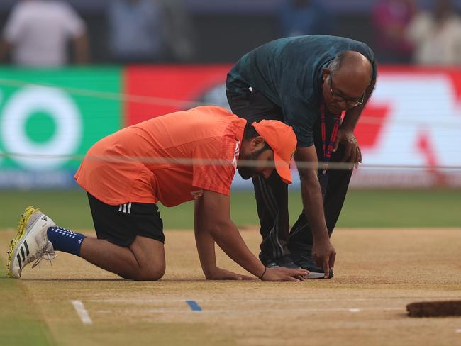 MUMBAI, INDIA - NOVEMBER 14: Rohit Sharma of India inspects the pitch during a India training session at the ICC Men's Cricket World Cup India 2023 at Wankhede Stadium on November 14, 2023 in Mumbai, India. (Photo by Robert Cianflone/Getty Images)