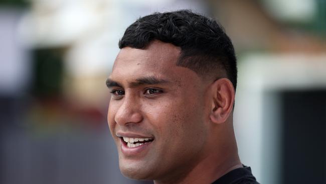 Tevita Pangai Junior outside Suncorp Stadium with the Wally Lewis statue, Milton. Picture: Liam Kidston