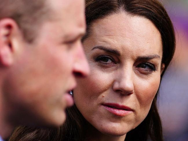 Britain's Prince William, Prince of Wales (L) and Britain's Catherine, Princess of Wales (C) visit the Aberfan memorial garden in Aberfan, south Wales on April 28, 2023, to pay their respects to those who lost their lives during the Aberfan disaster on October 21, 1966. - The garden sits on the site of the Pantglas school which was tragically destroyed in a coal-tip landslide on 21st October 1966. The incident led to the loss of 144 lives, including 116 children. (Photo by Ben Birchall / POOL / AFP)