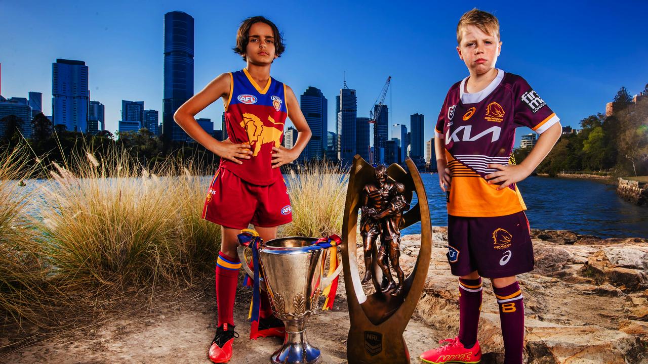 Lions fan Spencer Moore, 8, and Broncos fan Harry Wiseman, 8. Picture: Nigel Hallett