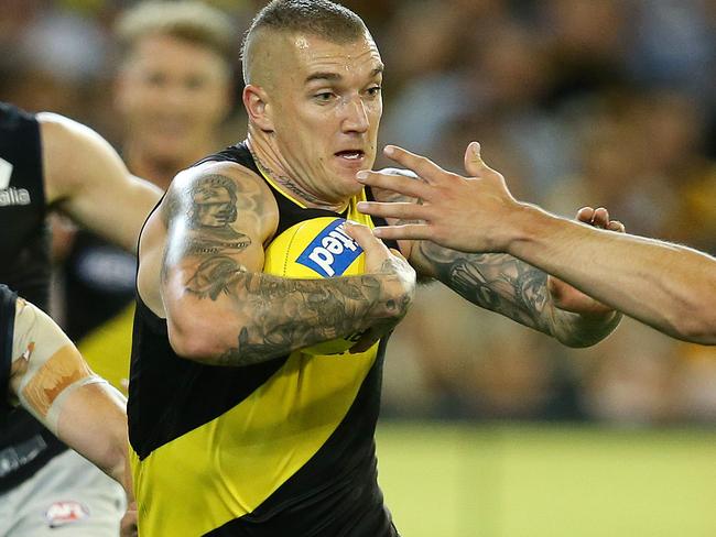 AFL Round 1.  Richmond v Carlton at the MCG. Richmond's Dustin Martin gives a don't argue to Carlton's Jacob Weitering as he gathers in the forward line  . Pic: Michael Klein