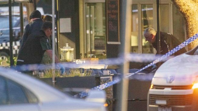 Police comb the scene at the Sweet Lulu cafe in Keilor. Picture: Tony Gough