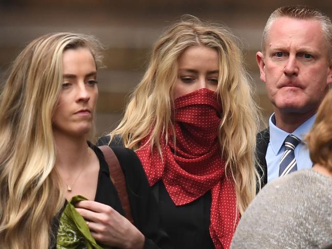 Amber Heard has used a red scarf in lieu of a mask amid COVID-19 safety precautions. Picture: AFP