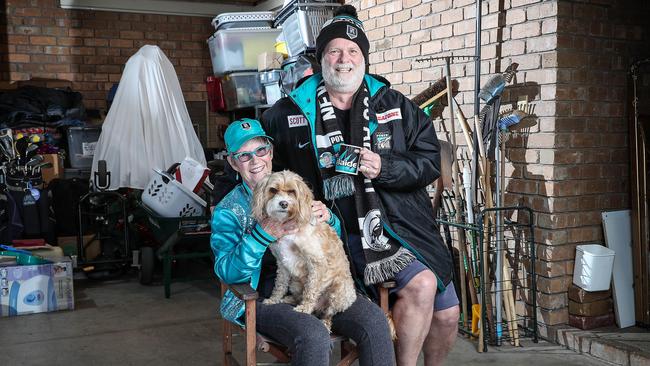 Avid Port Adelaide fans Sue Connor and her husband Greg were at the Power v Collingwood game at the MCG on Sunday and have been tested for Covid-19. They are currently in isolation with their dog Max. Picture: Sarah Reed