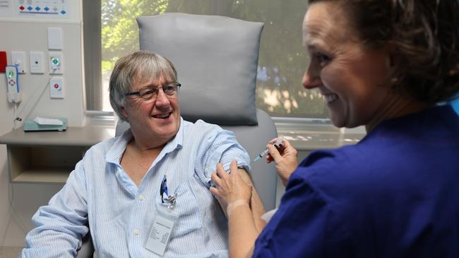 Dr Peter Rischbieth is given the AstraZeneca vaccine from nurse Maria Reich at Murray Bridge Hospital, east of Adelaide. Picture: AAP