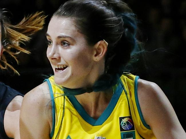 FIBA Oceania Championship at Rod Laver Arena. Australian Opals vs New Zealands Tall Ferns. Tessa Lavey drives hard around Micaela Cocks . Pic: Michael Klein