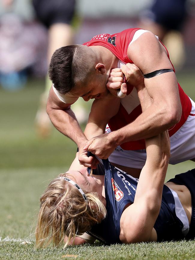 North’s Robert Young and South’s Jaidan Kappler get up close and personal. Picture Sarah Reed