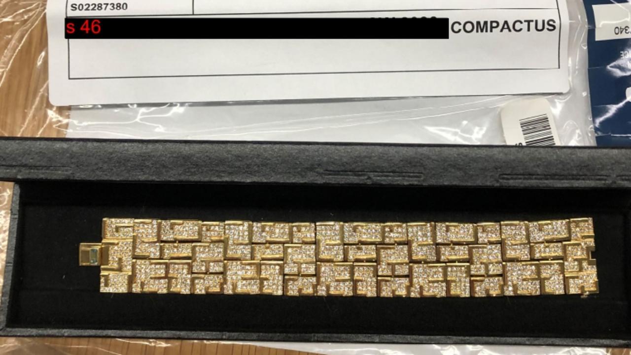A gold bracelet found during the police raid.