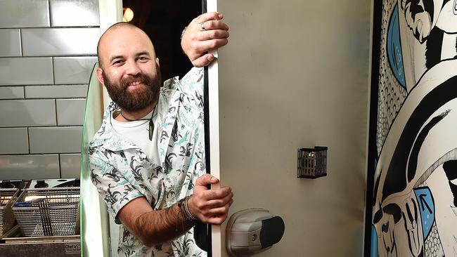 Same Rose from Jungle Boy in Chapel Street opening the refrigerator door at the bar’s entrance. Picture: Ellen Smith