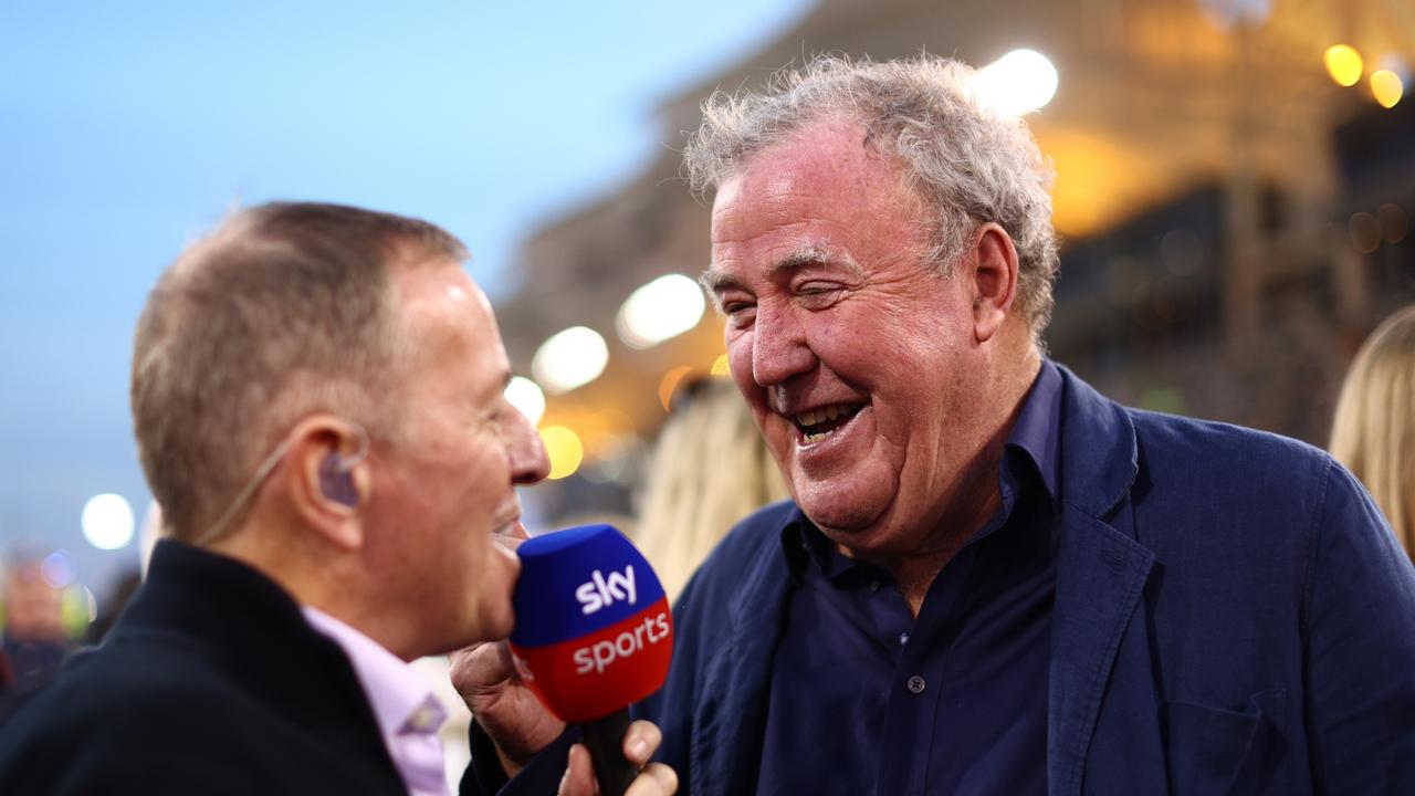 Jeremy Clarkson talks with Martin Brundle. Photo by Clive Rose/Getty Images.