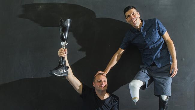 Mike Rolls took on the Eureka Tower Run and is pictured with Inspire the Community’s  Doug Hartmann. Picture: Valeriu Campan