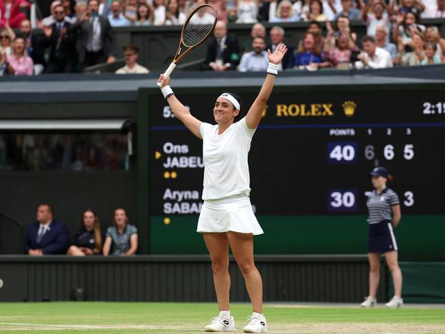 LONDON, ENGLAND - JULY 13: Ons Jabeur of Tunisia celebrates victory against Aryna Sabalenka following the Women's Singles Semi Finals on day eleven of The Championships Wimbledon 2023 at All England Lawn Tennis and Croquet Club on July 13, 2023 in London, England. (Photo by Patrick Smith/Getty Images) *** BESTPIX ***