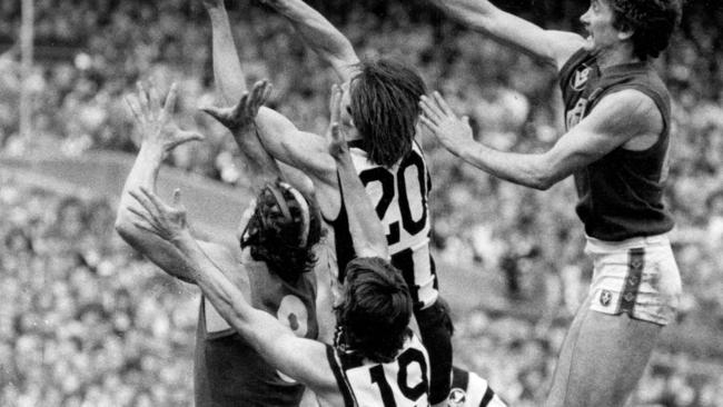 Fitzroy’s Garry Wilson is swamped from behind by Craig Davis, Ross Brewer and Terry O'Neill.