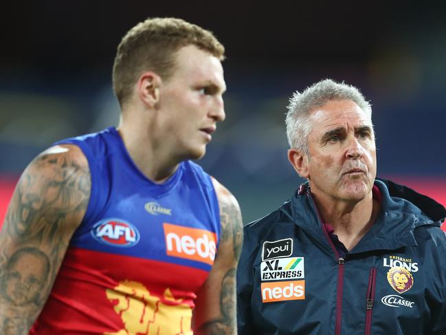 GOLD COAST, AUSTRALIA - JULY 26: Lions head coach Chris Fagan talks to Mitch Robinson of the Lions after winning the round 8 AFL match between the Melbourne Demons and the Brisbane Lions at Metricon Stadium on July 26, 2020 in Gold Coast, Australia. (Photo by Chris Hyde/Getty Images)