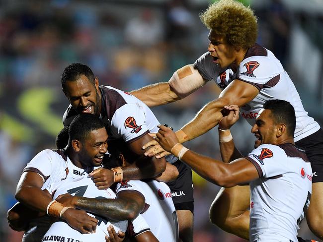 Fijian players celebrate the try of Joe Lovodua.