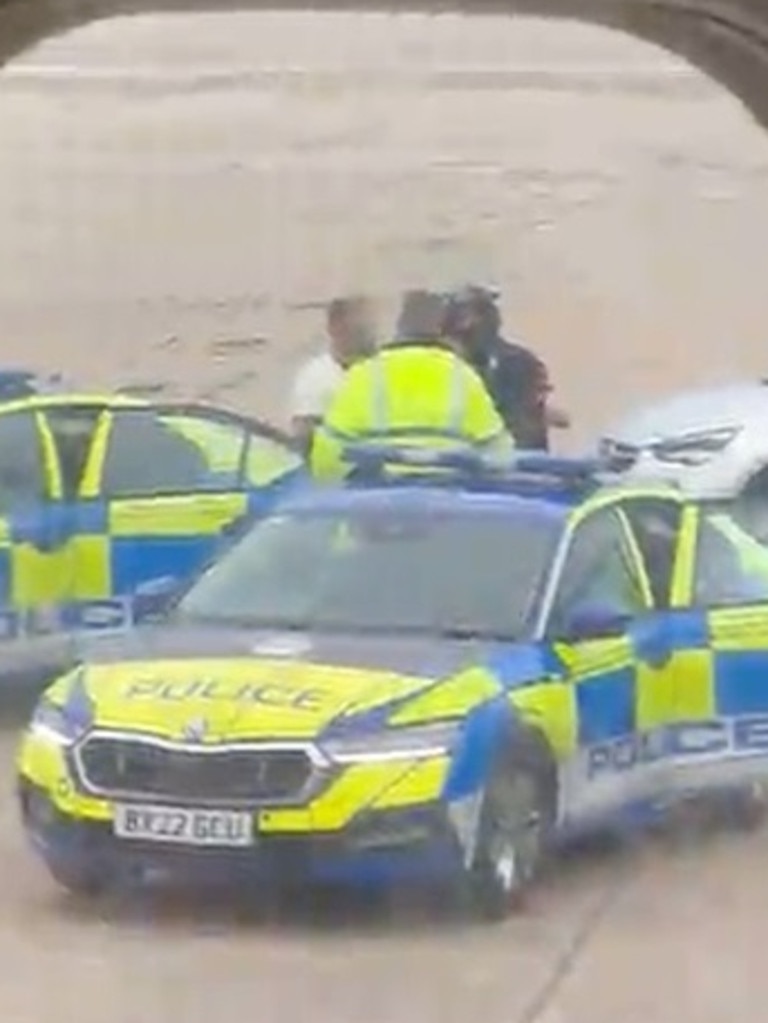 The man was led away by the police. Picture: Storyful