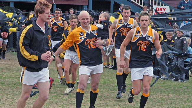 Frankston YCW's Brendan Long runs onto the ground in the 2007 grand final, also his 300th game.