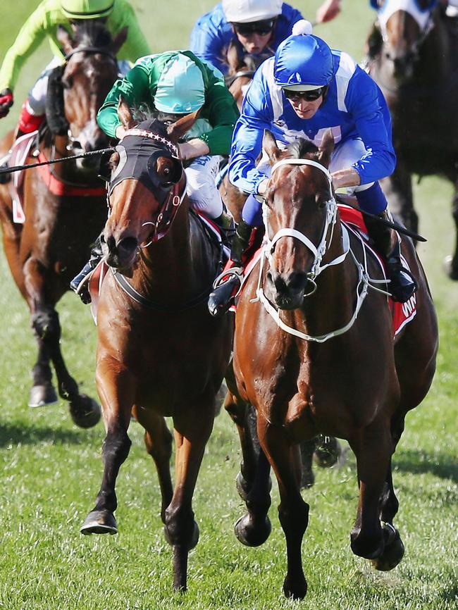 Winx and Hugh Bowman (blue cap) make it three Cox Plate wins.