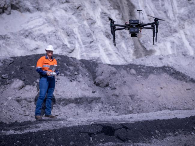 CAREERS: A worker using a drone at Glencore's Clermont mine. CAREERS USE ONLY