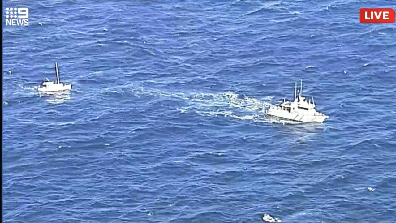 Police rescue the missing boaties near Salt Creek. Picture: Nine News