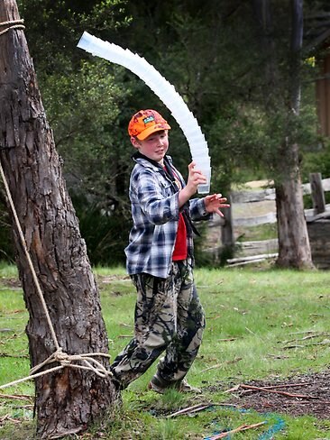 <p>Harry Cooling. from Margate, in the carrying the plastic cups race. Picture: Kim Eiszele</p>