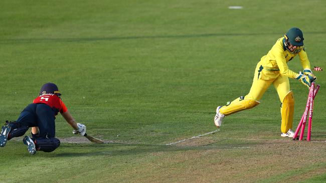 Alyssa Healy finds Heather Knight short of her ground.