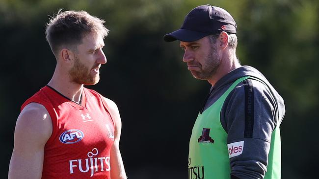 Business as usual? Hardly, as Essendon coach Ben Rutten and skipper Dyson Heppell talk at training on Friday. Picture: Michael Klein