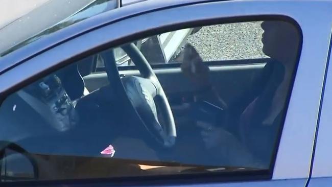 It’s me time behind the wheel for this woman applying make-up while driving in traffic. Picture: A Current Affair.