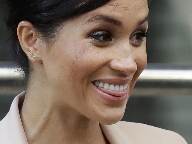 FILE - In this file photo dated Wednesday, Jan. 30, 2019, Britain's Meghan, The Duchess of Sussex, leaves after visiting the National Theatre in London. Prince Harry and his pregnant wife Meghan, say they have decided to keep plans around their first baby's arrival private, Kensington Palace officials said in a statement Thursday April 11, 2019. (AP Photo/Kirsty Wigglesworth, FILE)