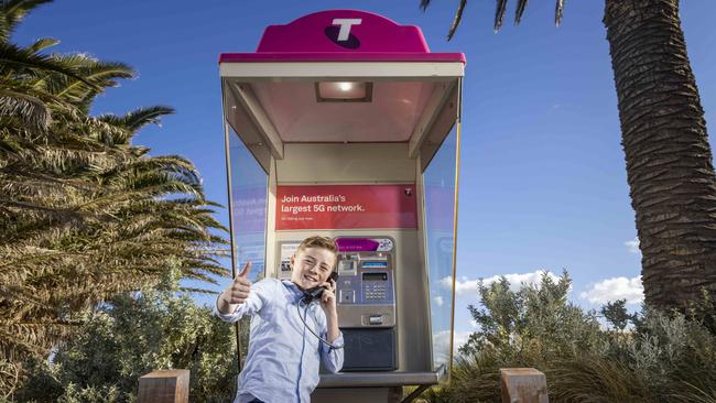 Public payphone calls were made free from August 2021. Ethan Carey, aged 11, at a public phone. Picture: Wayne Taylor