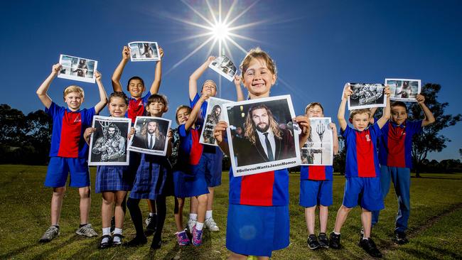 Bellevue Park State School students are campaigning to bring Aquaman star Jason Momoa to their school fete. Jade Williams, 5, is out the front leading the charge. Picture: Jerad Williams