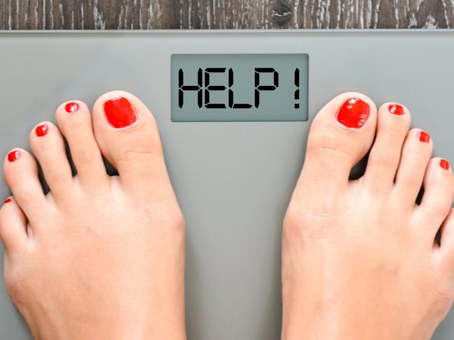 Lose weight concept with person on a scale measuring kilograms