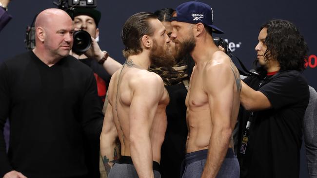 The two fighters go eyeball to eyeball at the weigh-in.