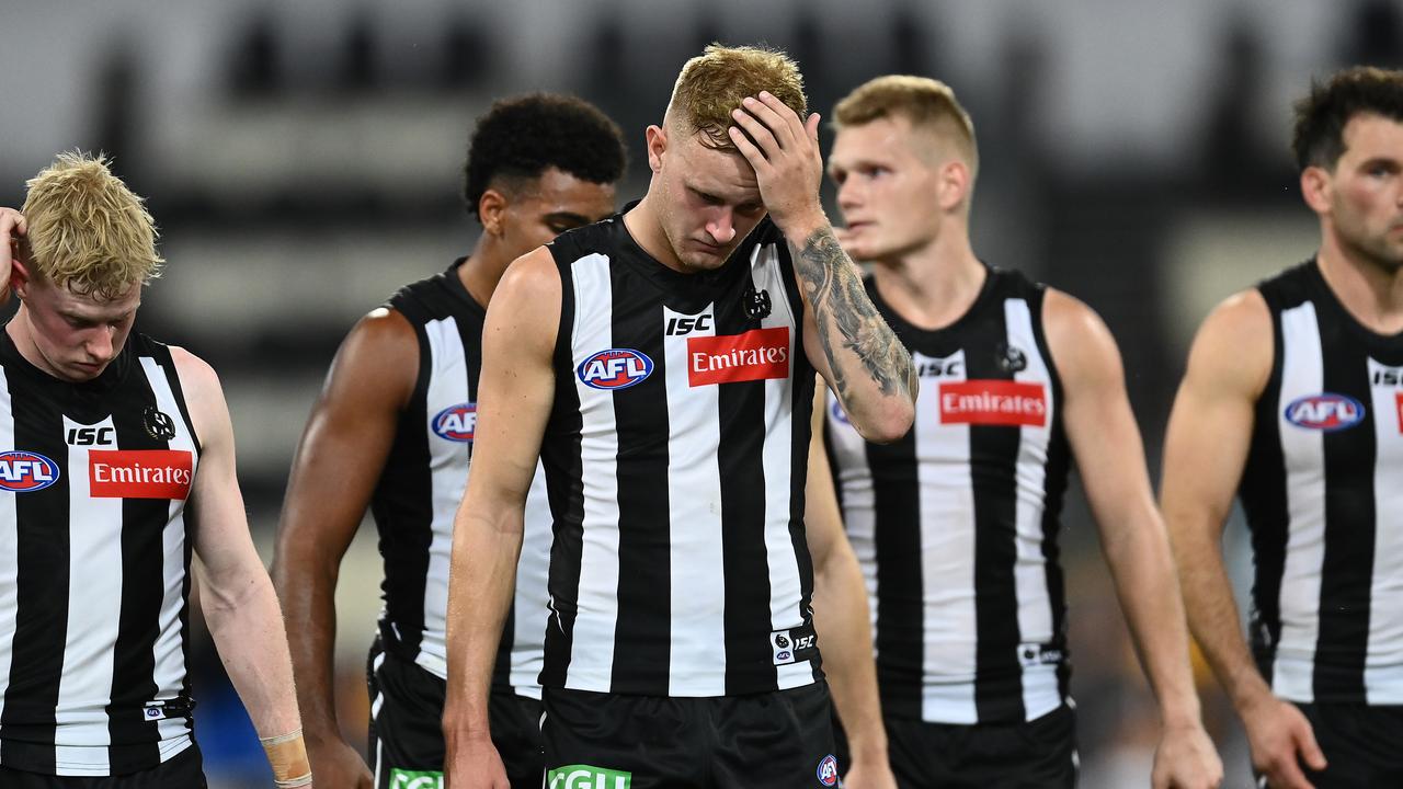 Collingwood players walk from the field after losing the semi-final to Geelong in 2020. For Jaidyn Stephenson (centre) and Adam Treloar (right), it would be their last game in the black and white. Picture: Quinn Rooney/Getty Images