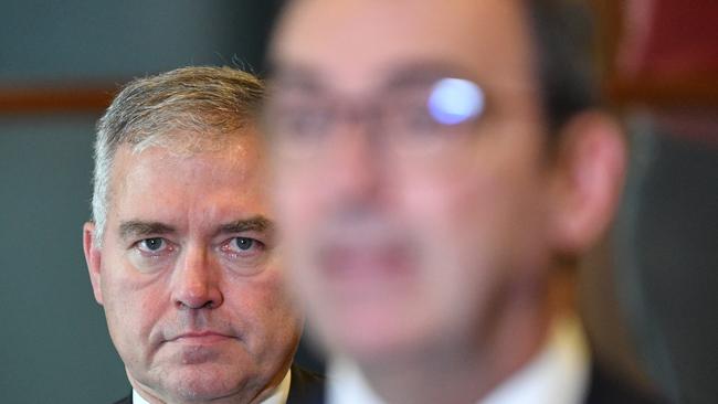 South Australian Health Minister Stephen Wade (left) looks on as Premier Steven Marshall speaks to the media. Picture: AAP