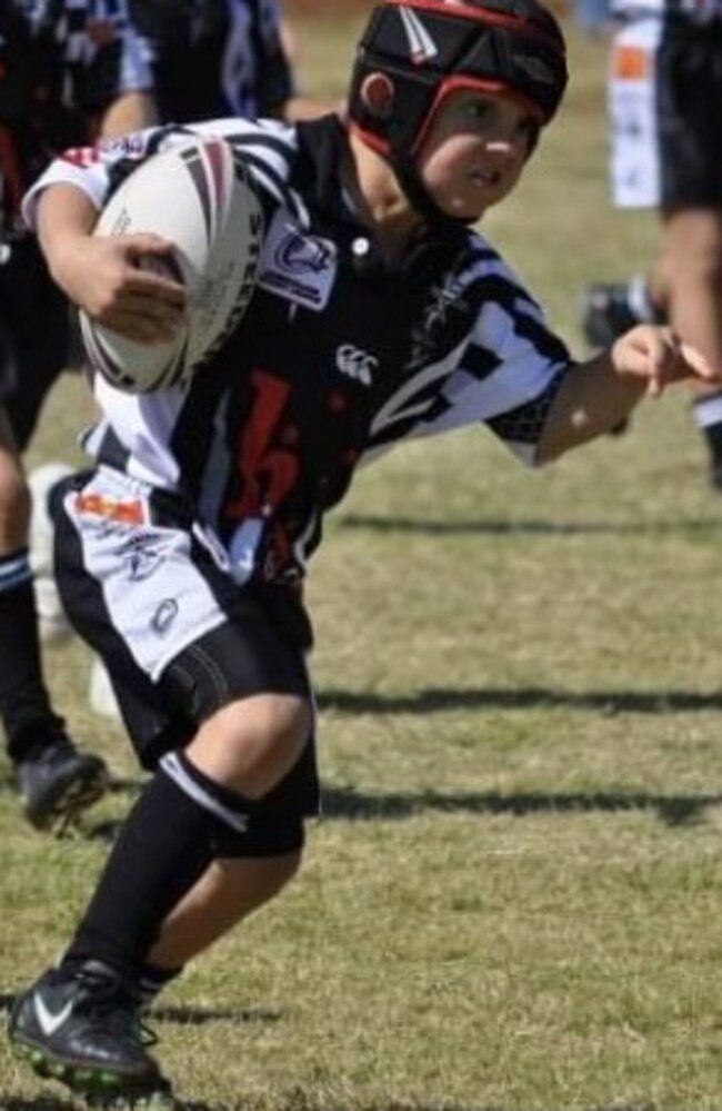 Eden playing football in Mount Isa for the Blackstars in under-7s.