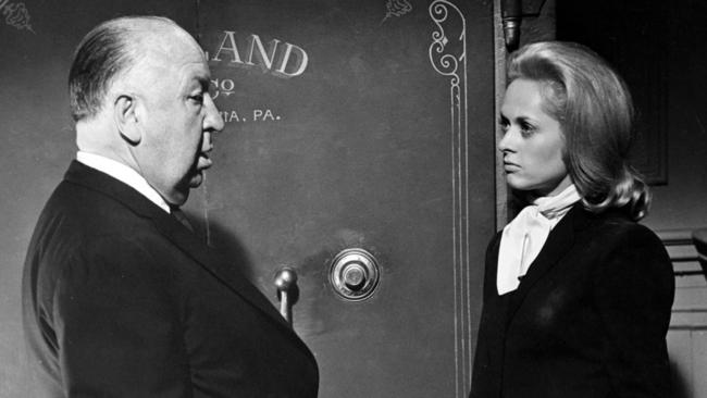 Alfred Hitchcock and Tippi Hedren on the set of the 1964 film Marnie